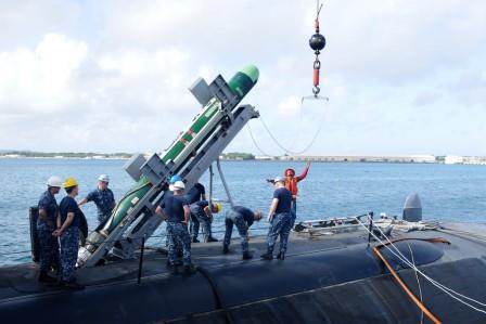 Mark 48 torpedo being loaded on fast attack nuclear submarine USS Oklahoma City (SSN-723).