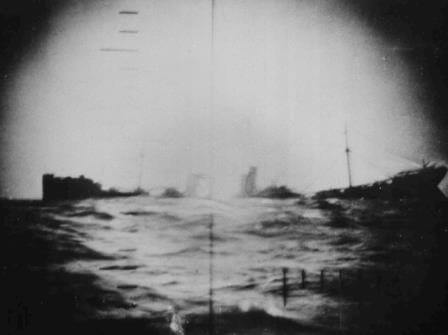 A torpedoed Japanese merchant ship sinks in the Pacific.