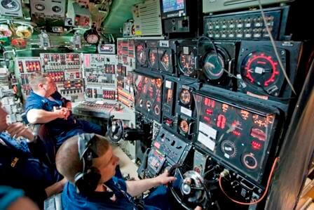 The helm/planes control 
				and the periscope are part of the Control Room
